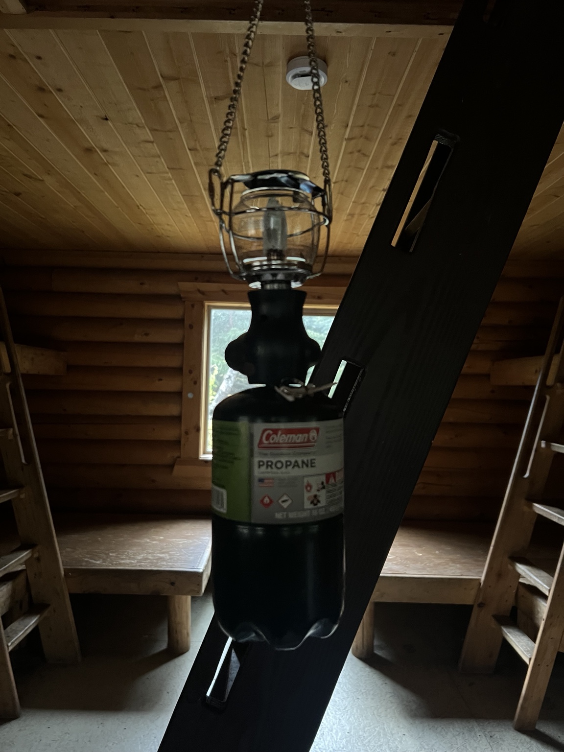 Coleman propane lantern hanging in the cabin